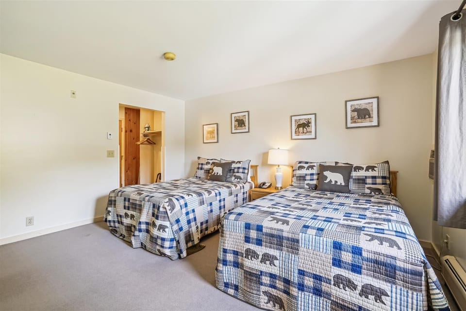 Two double beds in the bedroom.