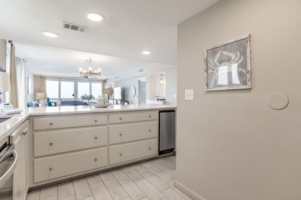 Kitchen with breakfast bar seating 5 at Wind Drift Orange Beach