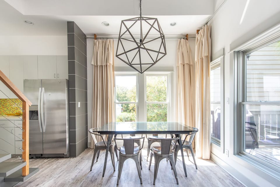 Dining Table, Chairs, Ceiling Lamp, Refrigerator, and Window Doors.