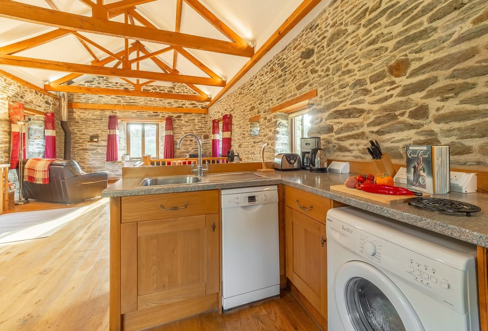The Threshing Barn, Truro. First floor: Fully equipped kitchen with dishwasher and washing machine