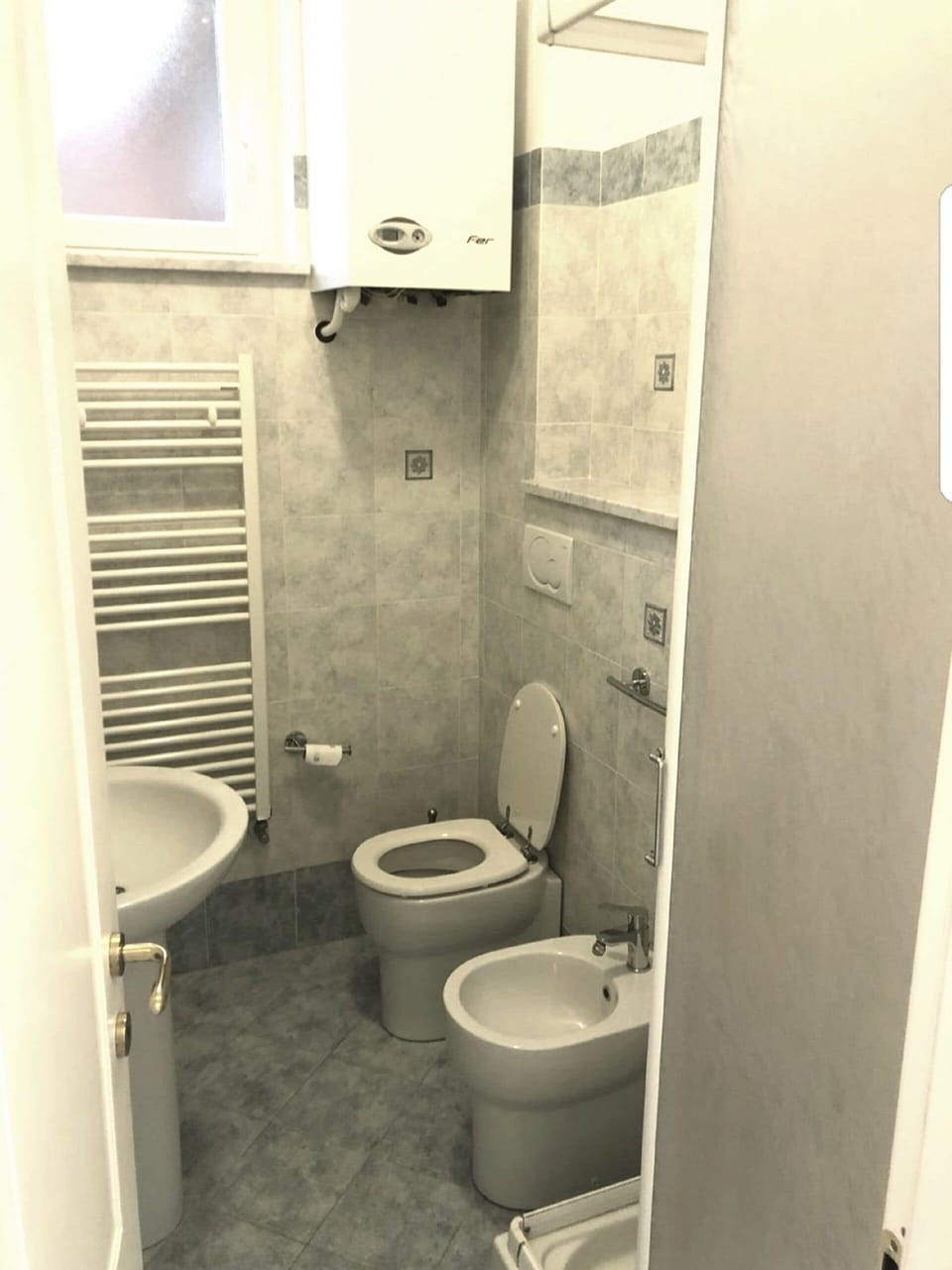 Separate tub and shower, hair dryer, bidet, towels