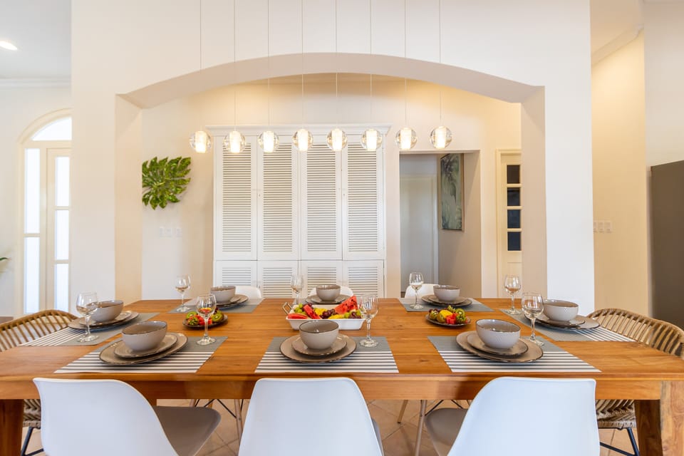 Enjoy the perfect mealtime ambiance at our stylish 8-seater dining table, a centerpiece for socializing and feasting.