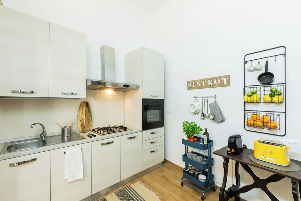 Apartment, 4 Bedrooms | Private kitchen | Full-size fridge, microwave, oven, stovetop