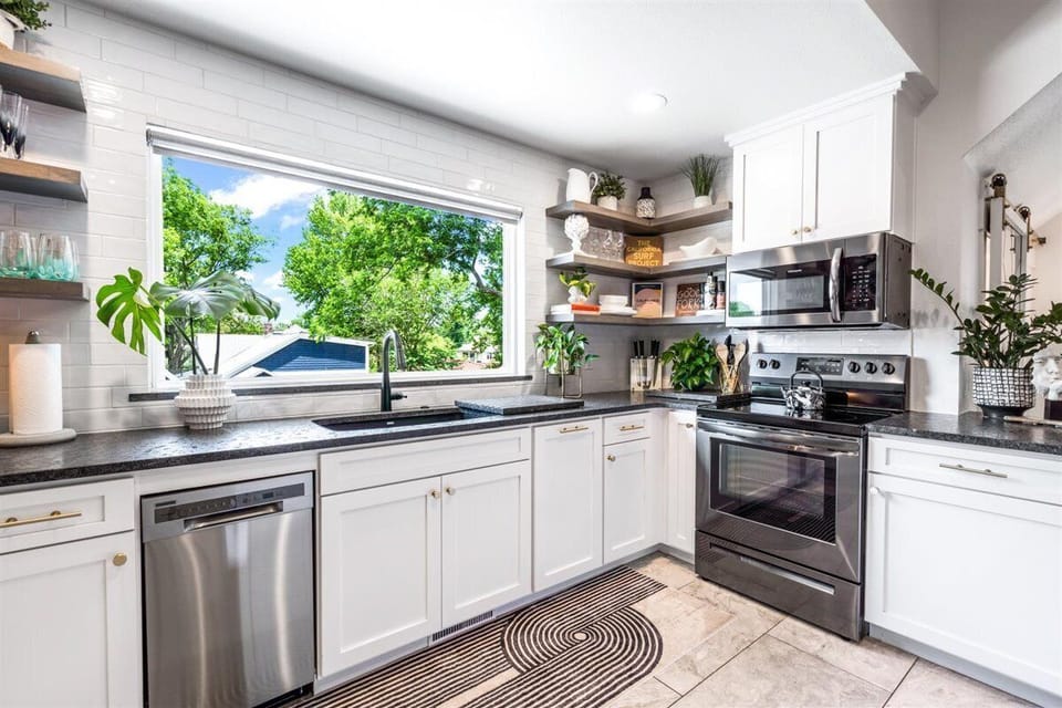 Fully stocked sunlit kitchen is a joy to cook in.