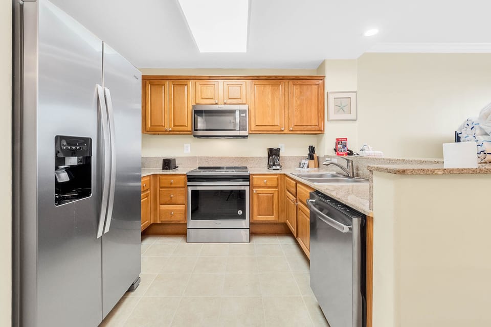 Granite and stainless steel appliances in the kitchen.