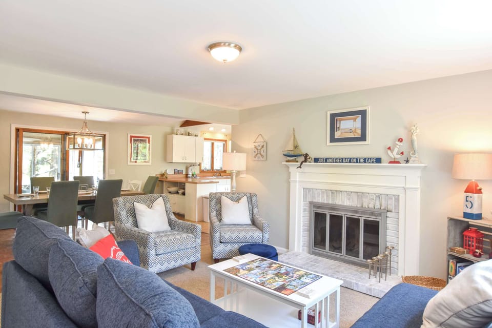 living room with large sectional with fireplace