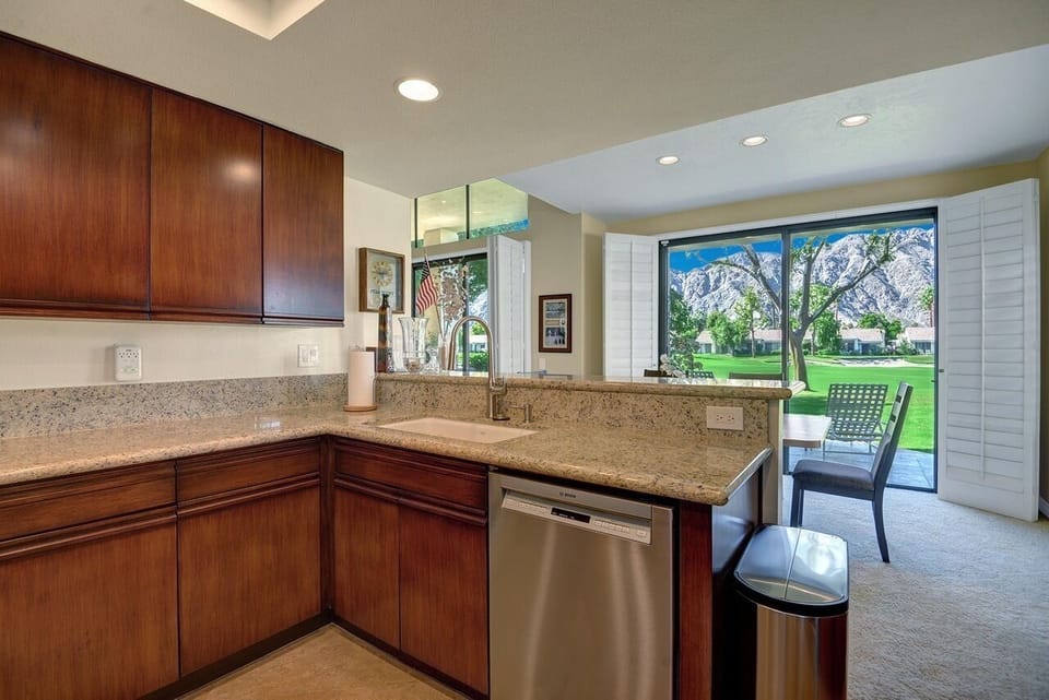 Lovely kitchen with new stainless steel appliances, counter tops and that view!