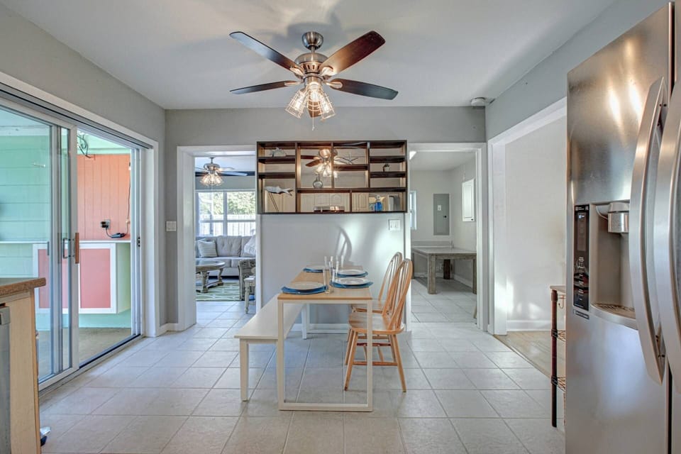 Dining area off the kitchen that seats 4-5 adults.  The sliders open out to the screened-in pool and patio.