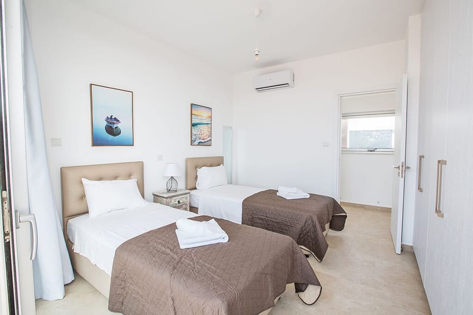 Bedroom 3 with two single beds and space for two extra beds