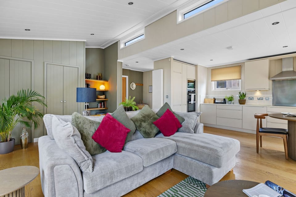 open plan living space, side tables, seating area and cooking facilities  - Amber Lodge