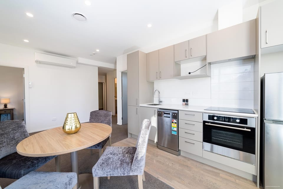 Private 2 Bedroom Executive Apartment | Private kitchen | Full-size fridge, microwave, oven, stovetop