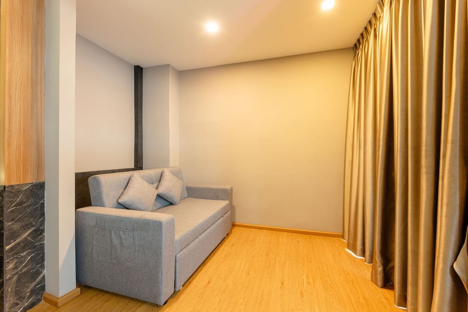 Family Studio, 1 King Bed with Sofa bed | Living area | 42-inch LED TV with cable channels, TV