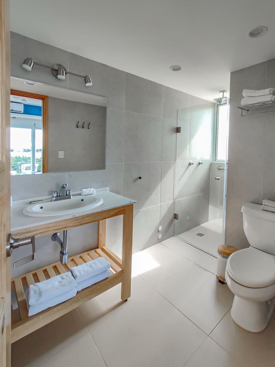 Shower, rainfall showerhead, hair dryer, towels