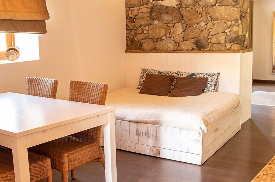 Suite (Agua Benta) | Living area | Flat-screen TV, foosball, books, heated floors