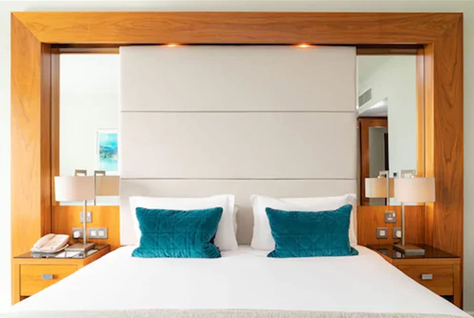 Premium bedding, down comforters, pillowtop beds, in-room safe