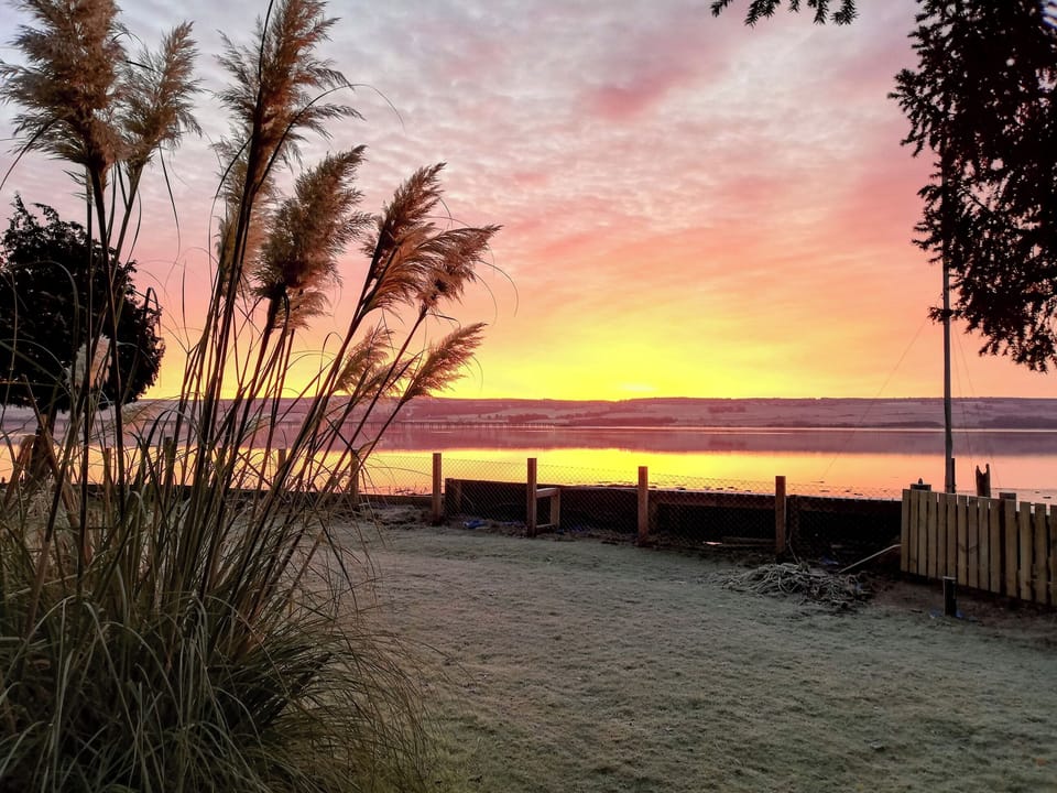 Large lawned enclosed garden with garden furniture | St Brighs, Dingwall