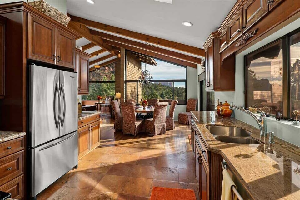 The kitchen is spacious and fully-equipped with modern appliances and amenities