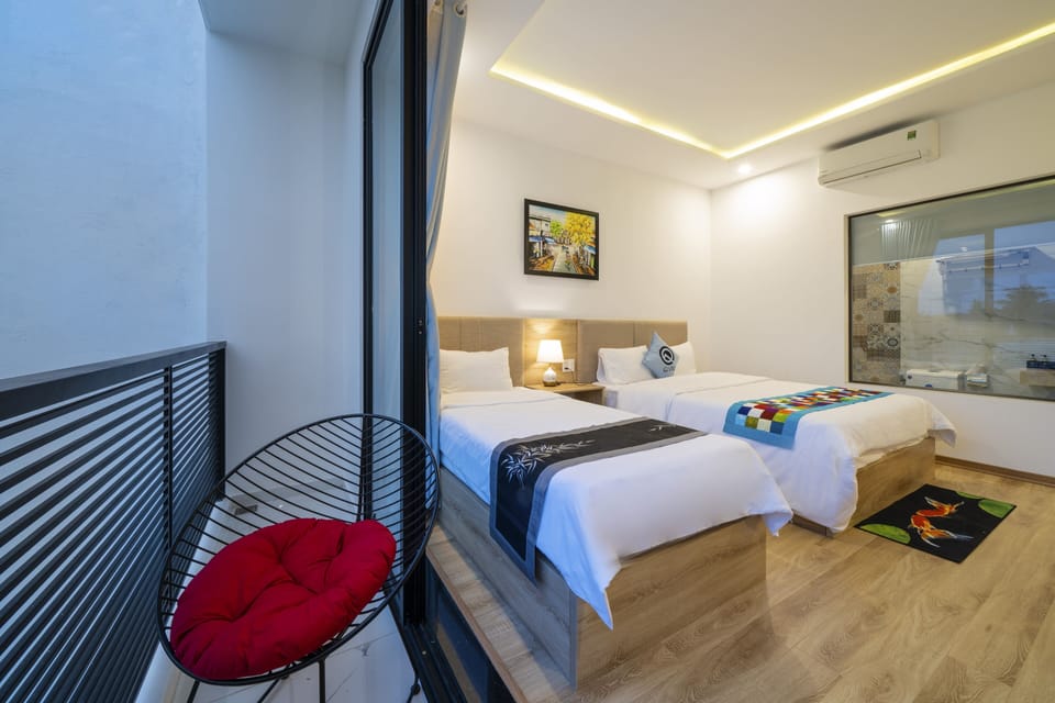 Deluxe Triple Room, Balcony | Minibar, individually decorated, individually furnished, desk