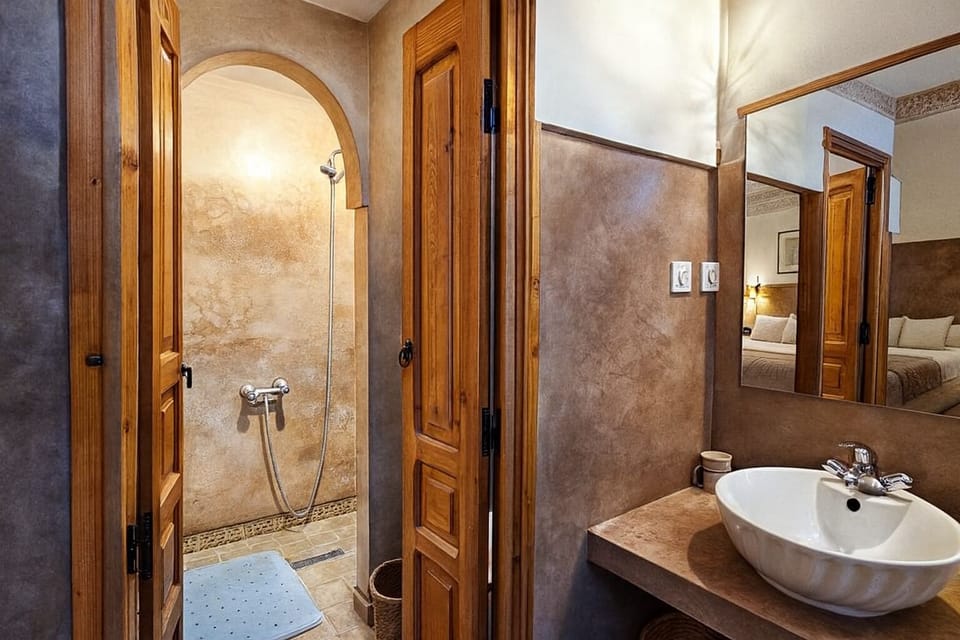 Superior Triple Room (Le Nid) | Bathroom | Shower, hair dryer, towels, soap