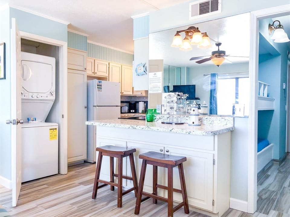 Condo, 1 King Bed with Sofa bed (The Summit 1030) | Private kitchen | Oven, toaster, ice maker, dining tables