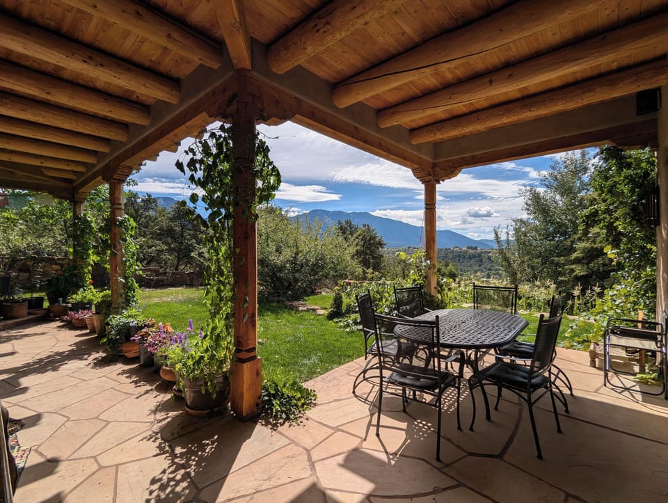 Gorgeous views from the back porch w. dining area, grill and couches to lounge.