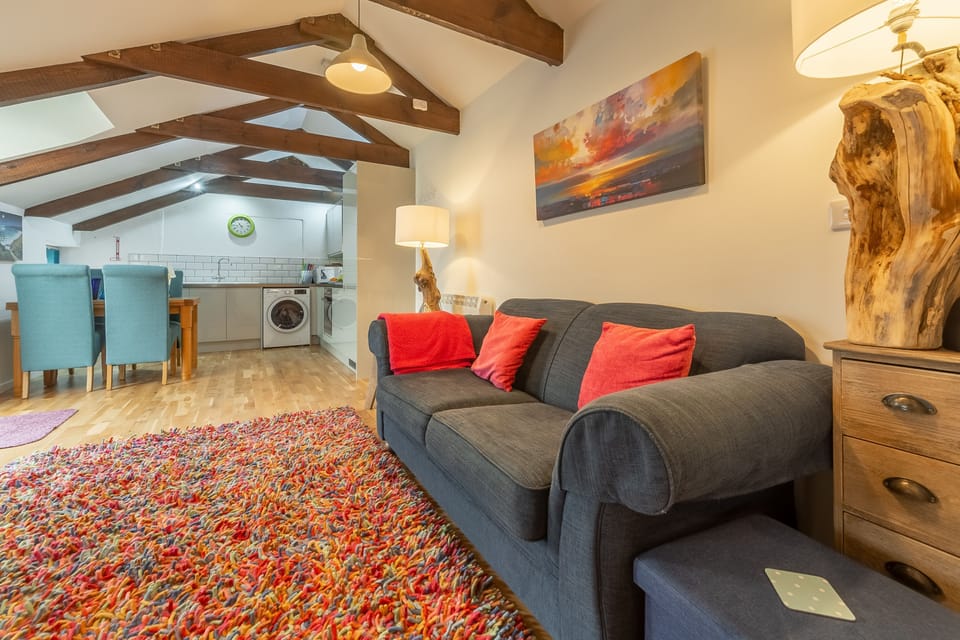 Potter's Barn, St Agnes. Open plan living area with sofa bed for one guest
