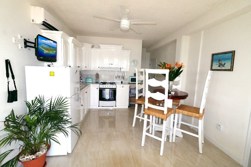 Kitchen with dinette is perfect for a quick snack or to prepare full meals. 