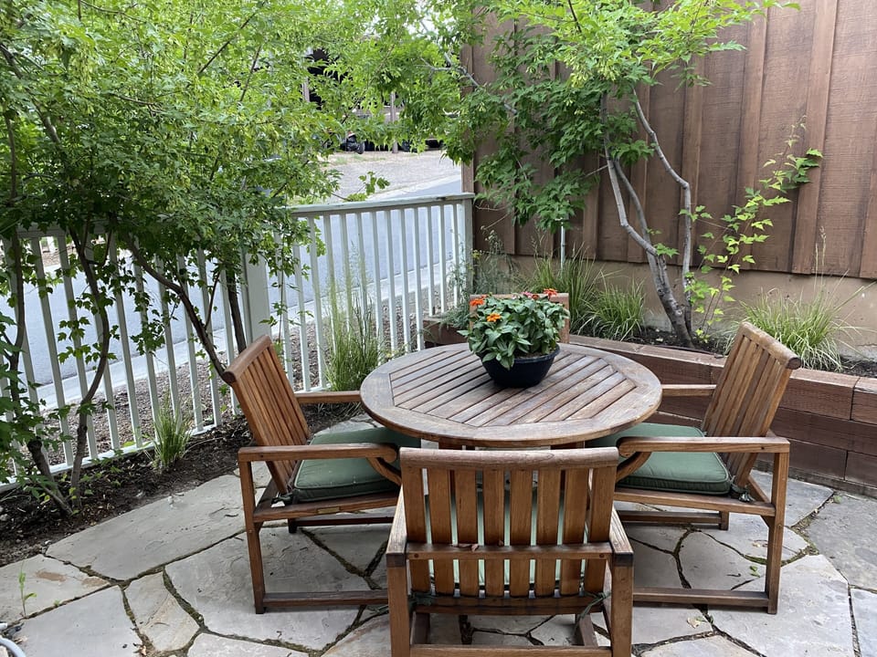 private back flagstone patio with bbq