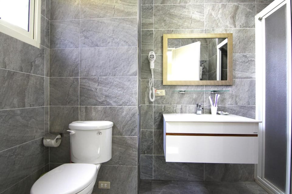 Shower, free toiletries, hair dryer, slippers