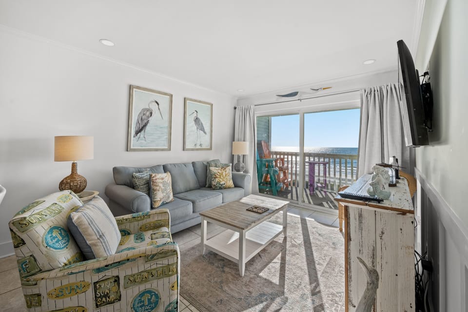 Such a charming oceanfront living room for everyone to enjoy.