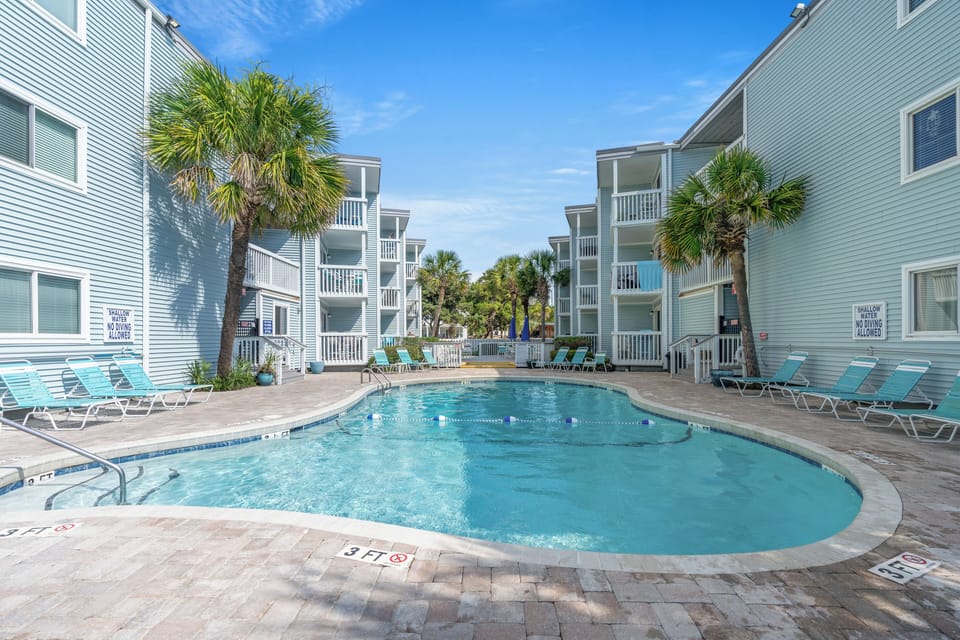 Take an evening dip in the sparkling pool after a fun day at the beach.