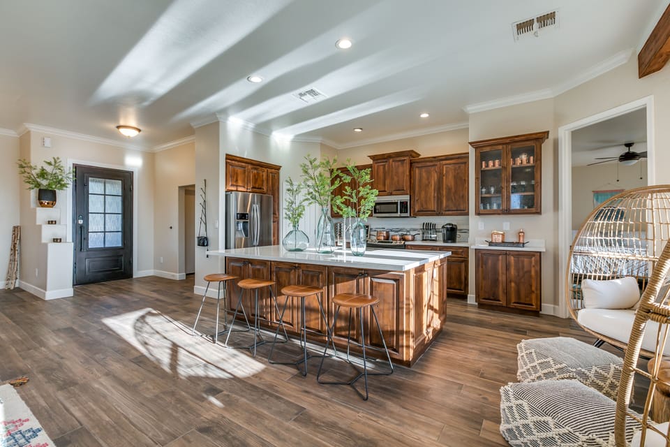 The Great Room features a designer kitchen, dining room and billiards table