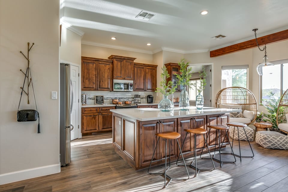 Kitchen island is massive and has seating for 4, kitchen is fully equipped