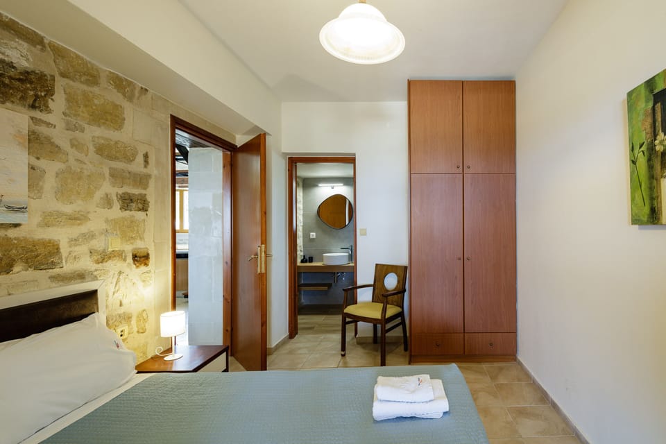 Lower floor bedroom with double bed and private full bathroom.