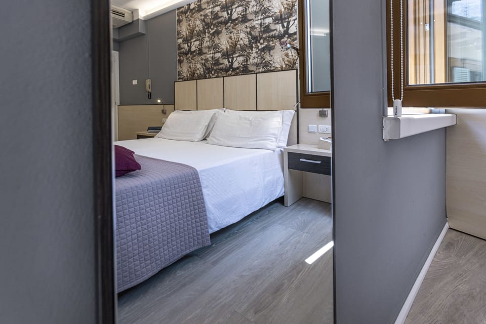 Double or Twin Room | Minibar, in-room safe, desk, blackout drapes