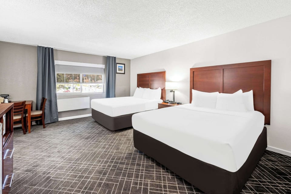 Standard Room, 2 Queen Beds, Non Smoking | Premium bedding, desk, laptop workspace, blackout drapes