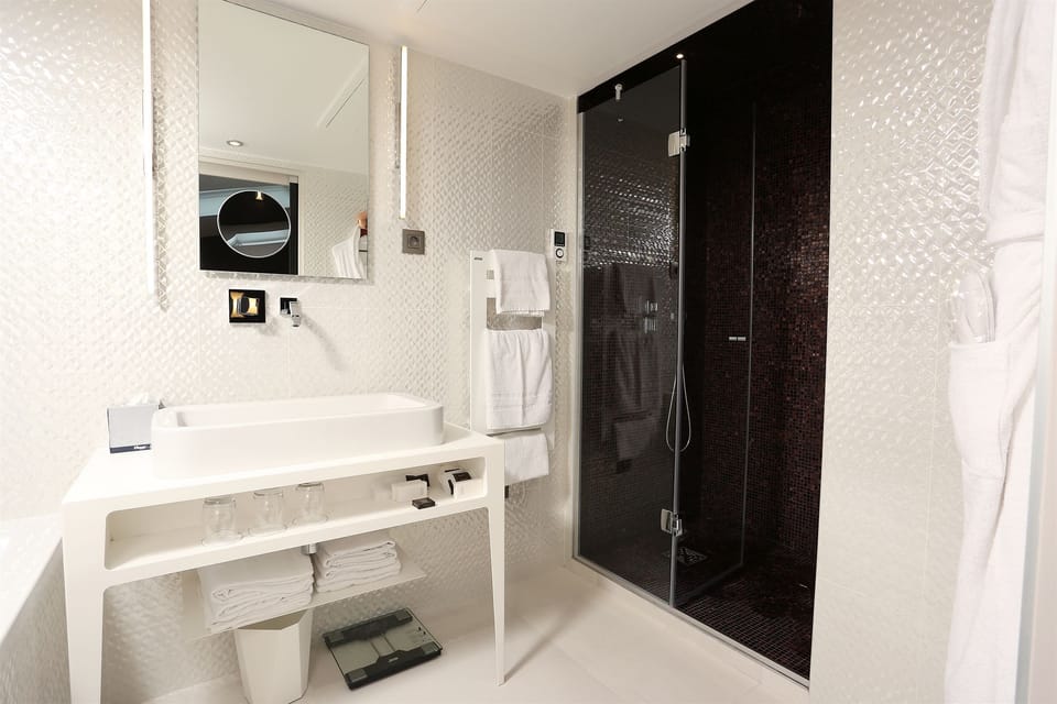 Shower, rainfall showerhead, designer toiletries, hair dryer