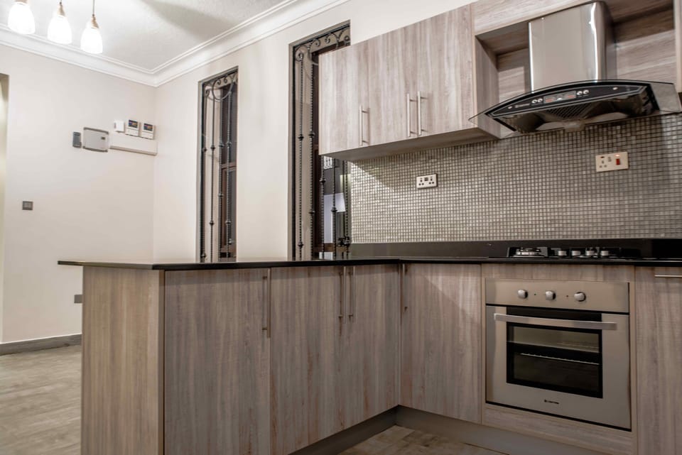 Family Apartment | Private kitchen | Full-size fridge, microwave, oven, stovetop