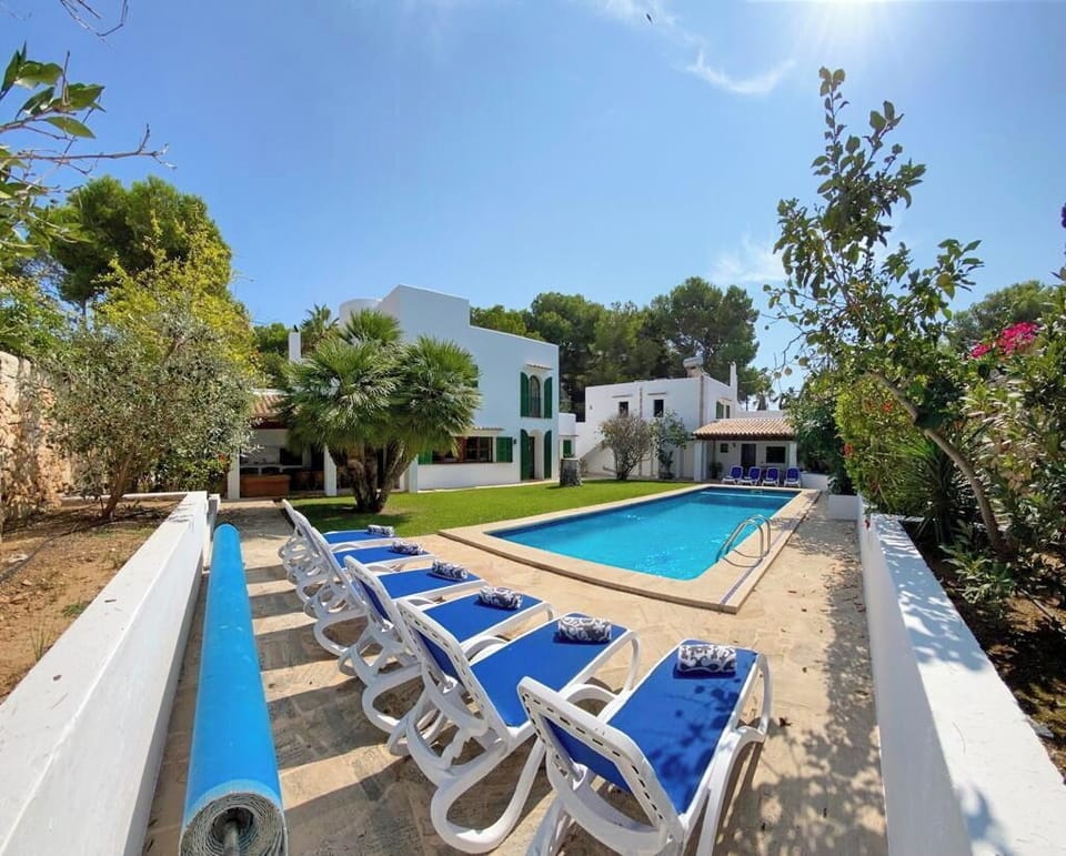 Pool Area with amazing garden, solarium and exterior living area.
