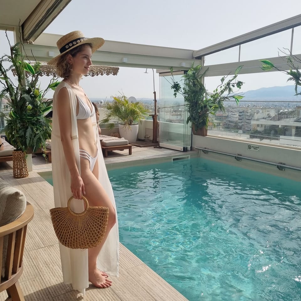 Seasonal outdoor pool, open 10:00 AM to 7:00 PM, pool umbrellas