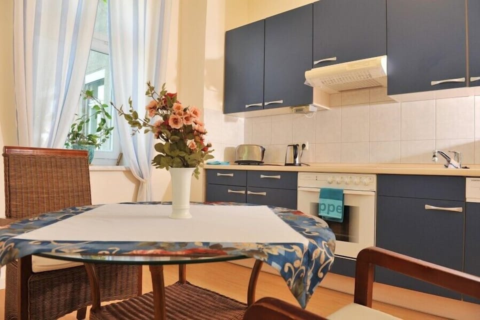 Grand Suite | Private kitchen | Fridge, coffee/tea maker, eco-friendly cleaning products, dining tables