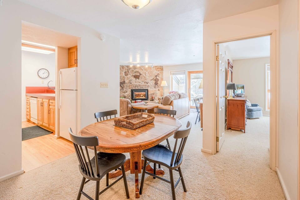 Adjacent to the Kitchen is the Dining Area w a Table Has Comfortable Seating for 4, Additional Seating at Breakfast Bar