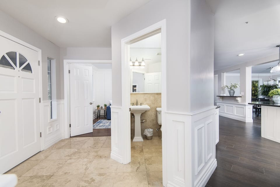 1/2 bathroom adjacent to Kitchen and Living Room 1.