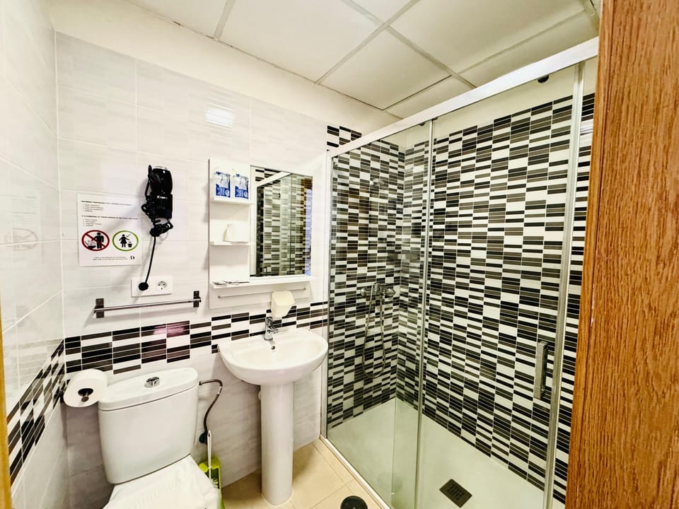 Triple Room | Bathroom | Shower, hair dryer, towels, soap