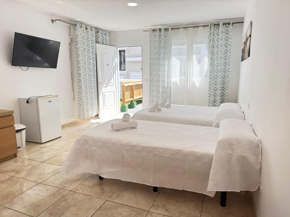 Classic Triple Room | Minibar, in-room safe, individually furnished, desk