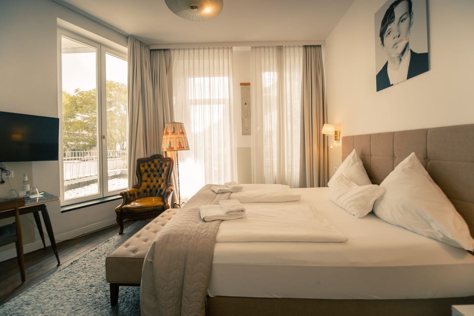 Deluxe Double Room | Minibar, blackout drapes, iron/ironing board, free WiFi