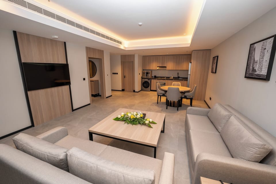 Executive Suite, 1 Bedroom | Living area | TV