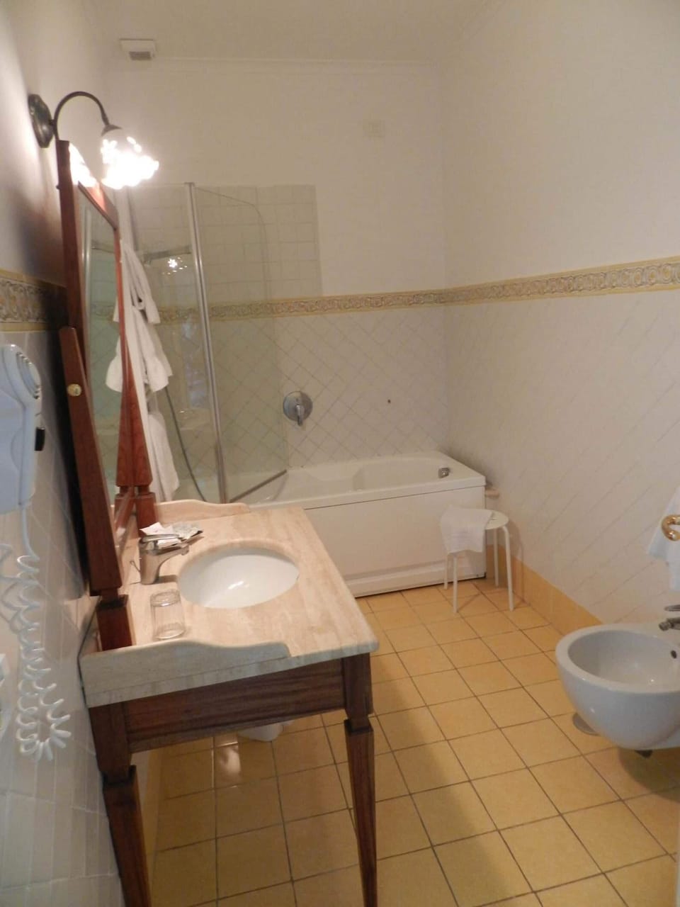 Combined shower/tub, free toiletries, hair dryer, slippers