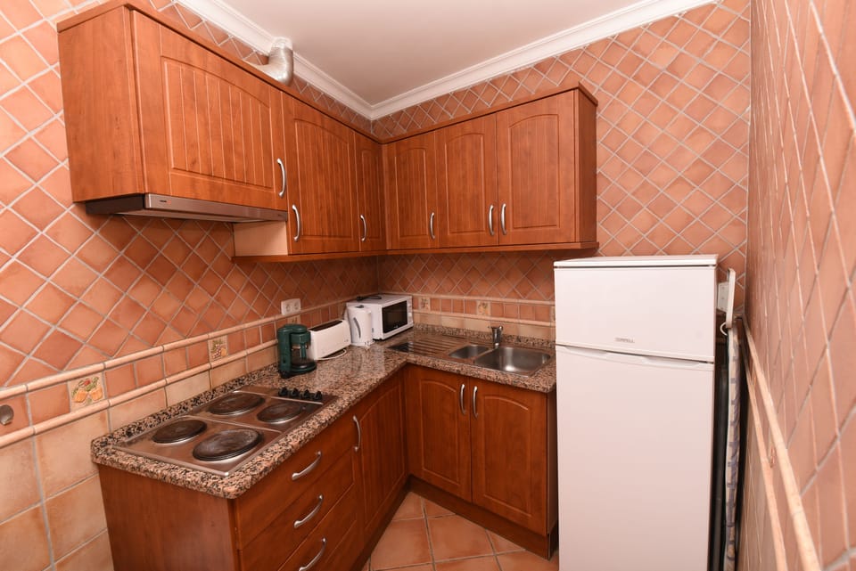 Apartment, 1 Bedroom | Private kitchen | Fridge, microwave, stovetop, coffee/tea maker
