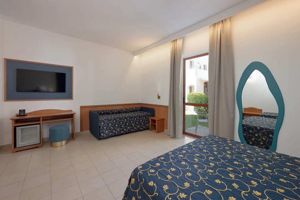 Standard Room, Garden View, beach Facilities Excluded | Minibar, in-room safe, cribs (surcharge), bed sheets